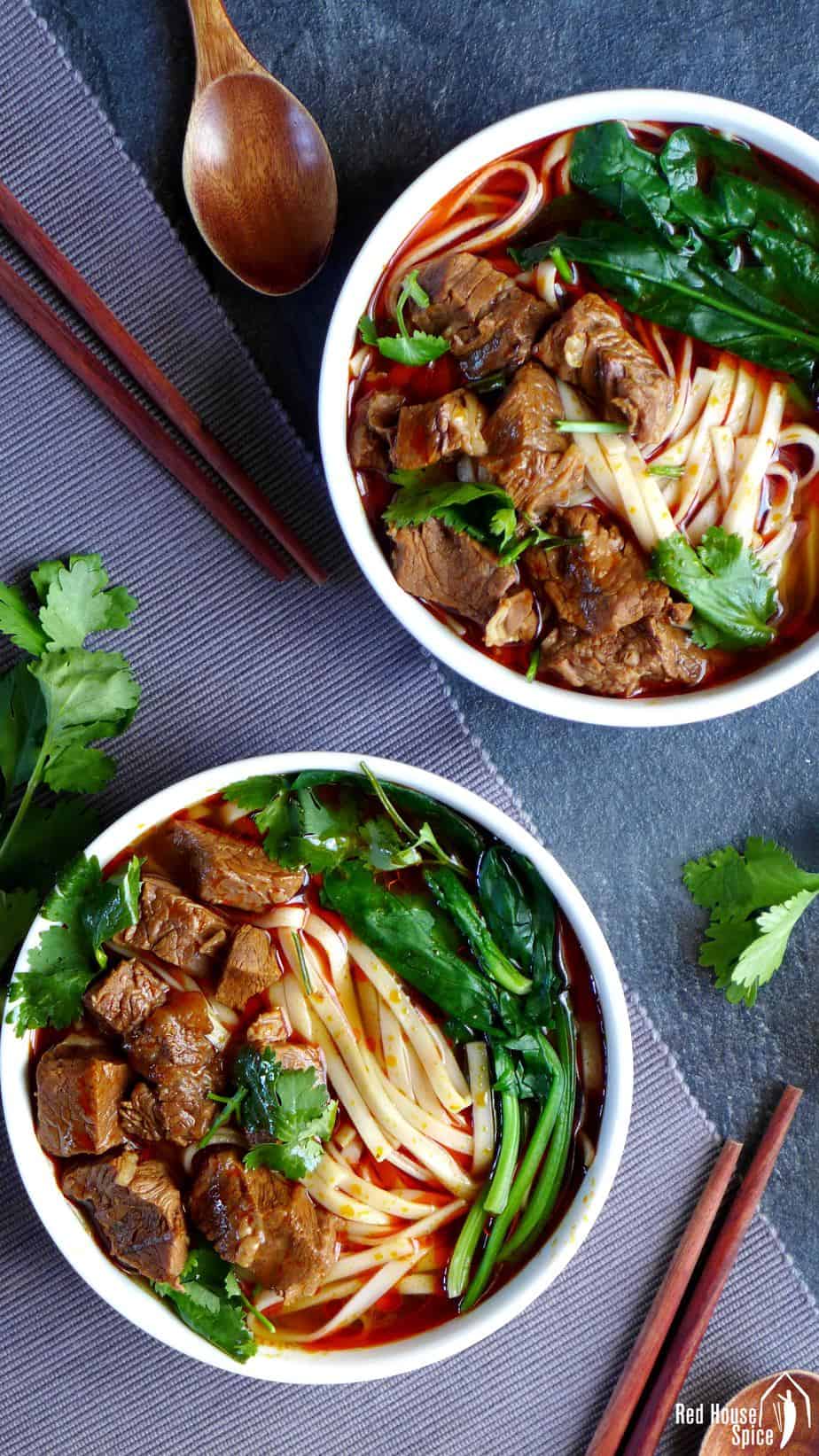 Two bowls of Sichuan style beef noodle soup