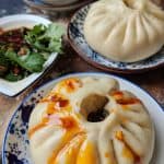 A fluffy steamed bao bun dressed with chilli oil. Looks very appetizing.