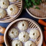 Steamed bao buns in bamboo baskets