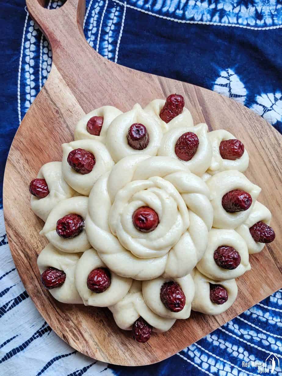 A steamed bun decorated with Chinese dates.