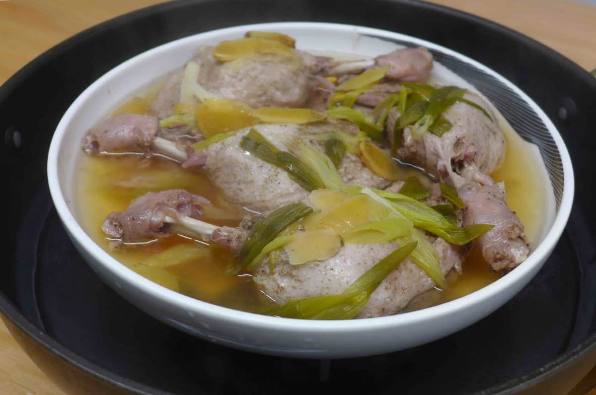 steamed duck legs in a plate.
