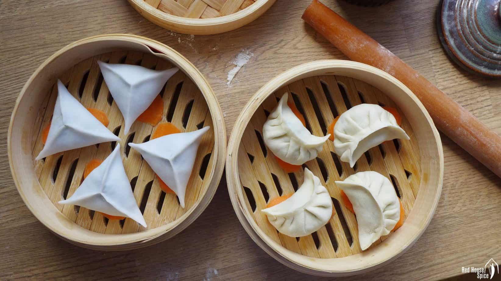 Uncooked dumplings in bamboo steamers