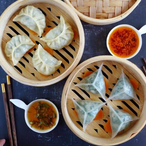 two types of steamed dumplings in bamboo baskets