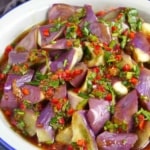 a plate of steamed eggplant with chili garlic dressing