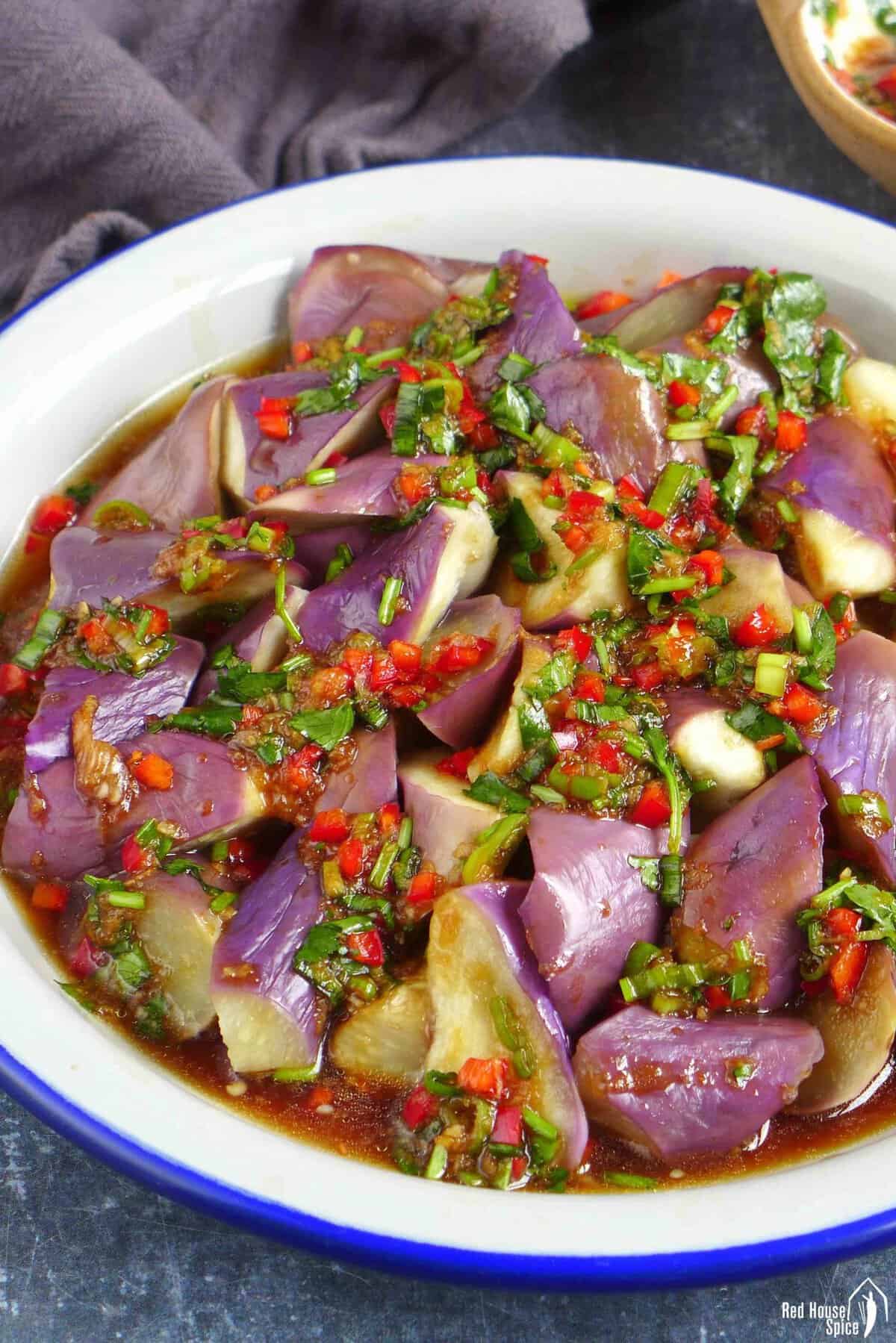 a plate of steamed eggplant with chili garlic dressing