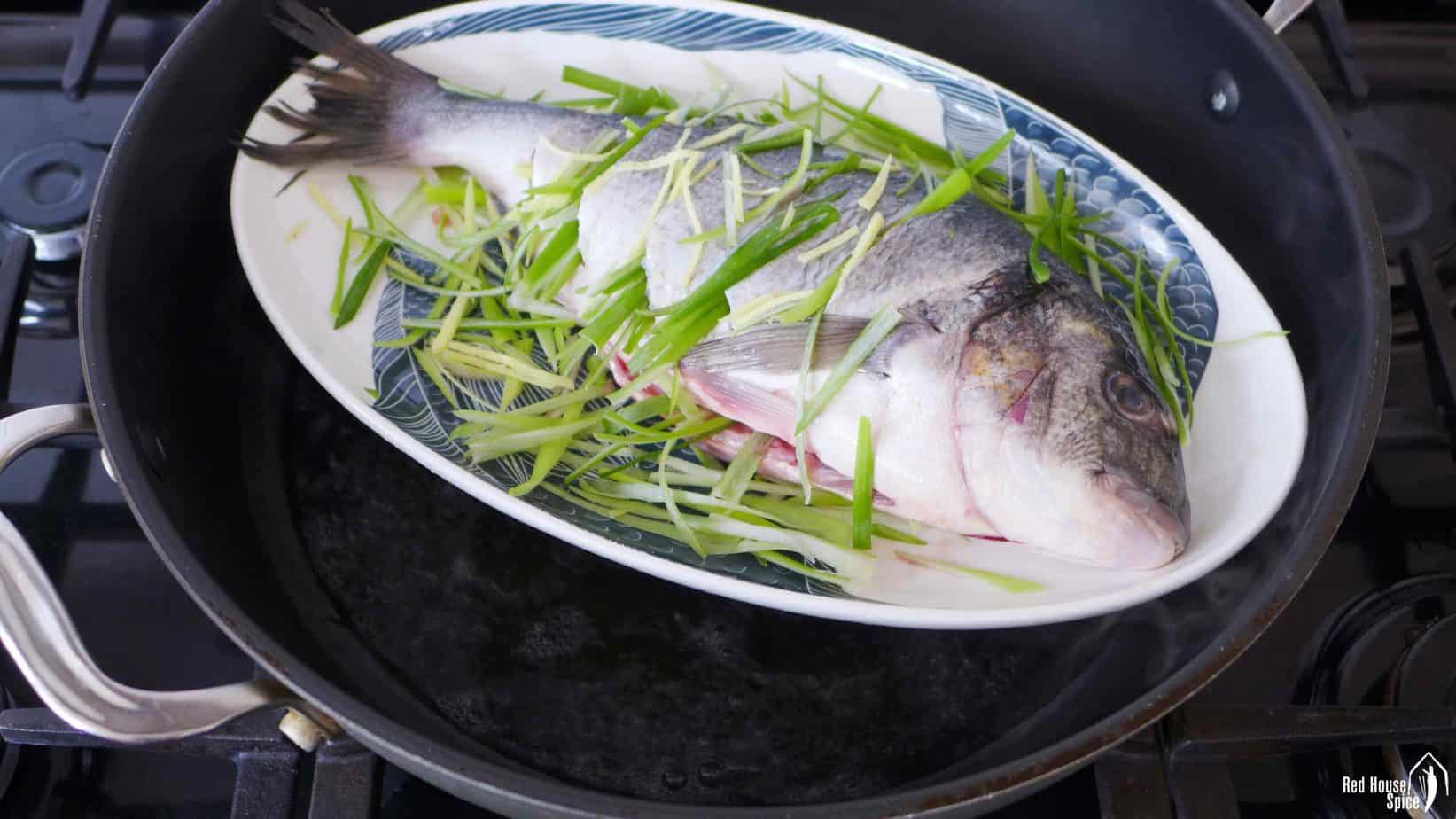 A plate of fish in a wok