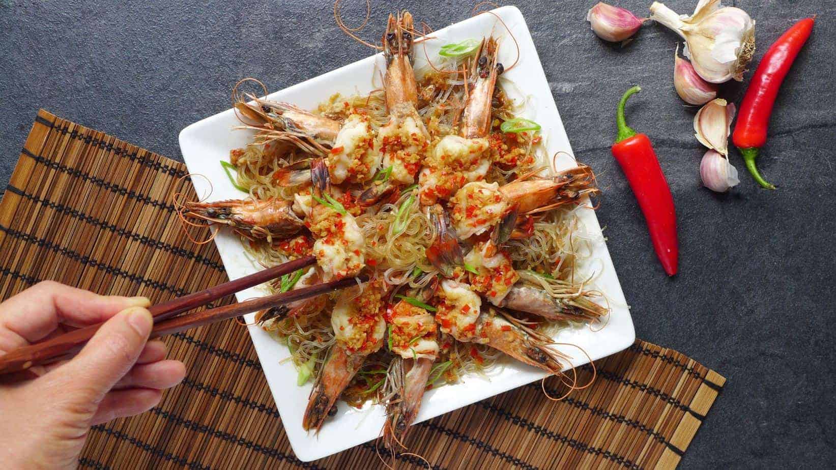 A plate of steamed prawns and mung bean noodles