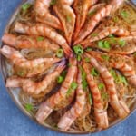 steamed garlic shrimp with vermicelli on a plate.