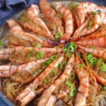 shrimp with garlic sauce over vermicelli with overlay text that says steamed garlic shrimp.