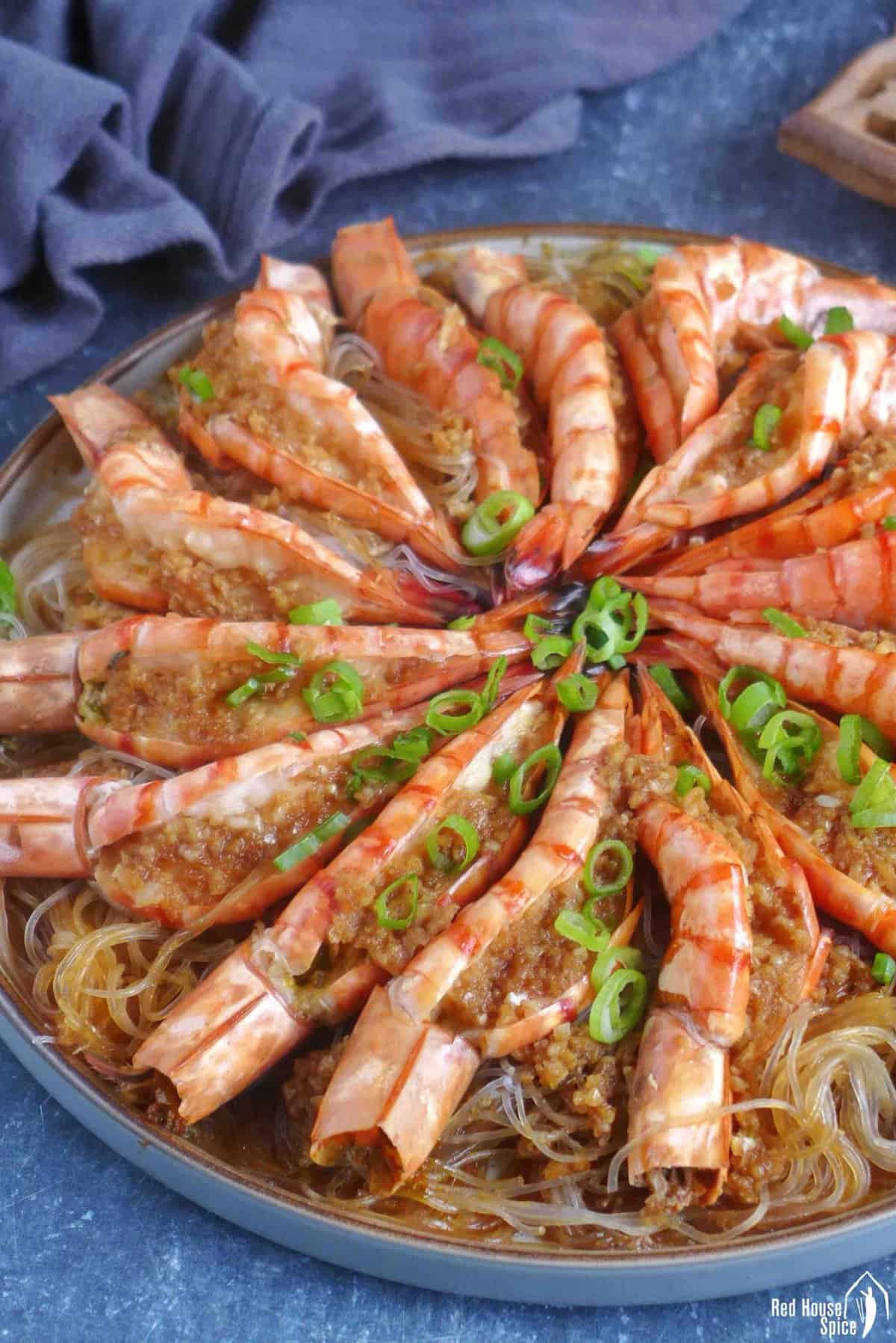 steamed garlic shrimp with vermicelli on a plate.