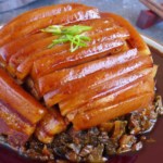 Mei cai kou rou on a plate.