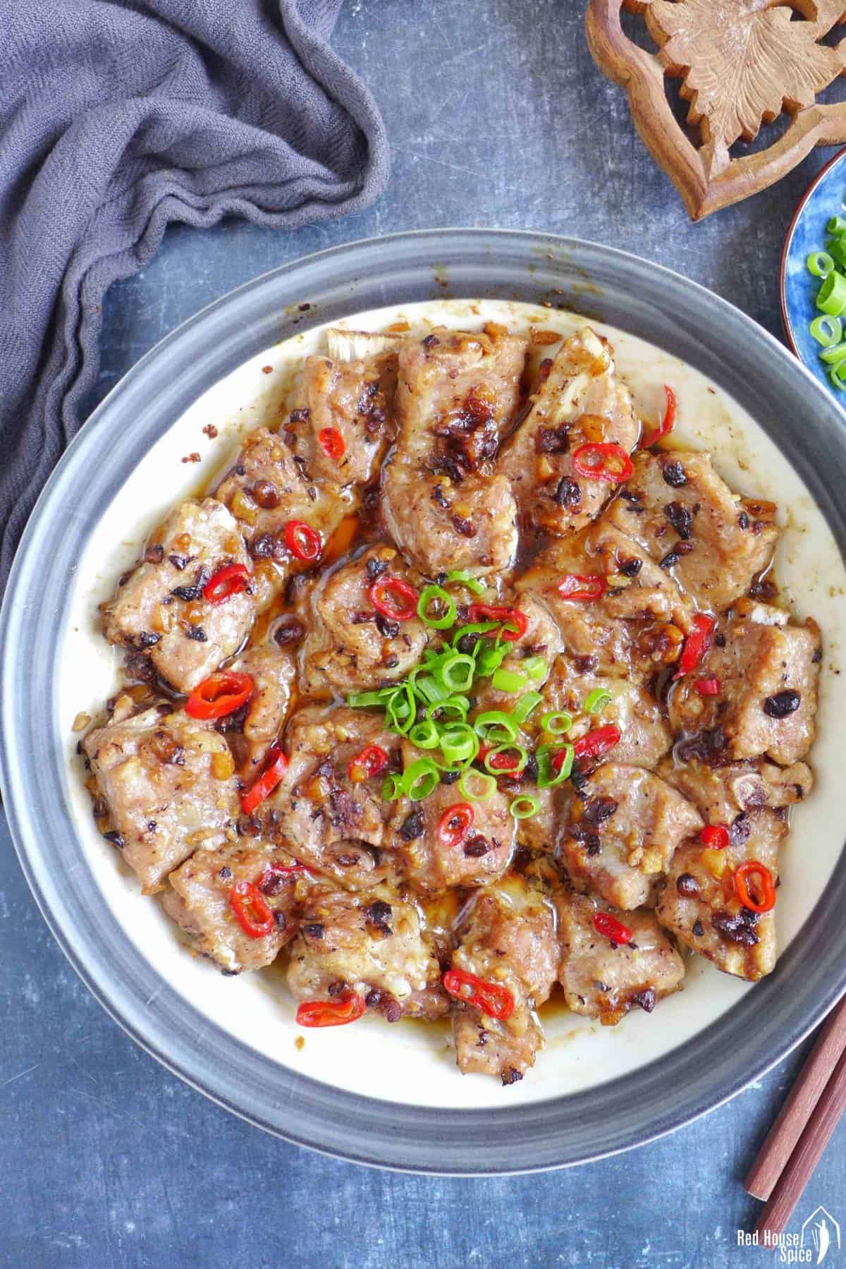 a plate of steamed ribs with fermented black beans and chili pepper.