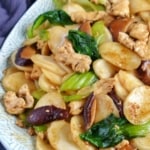 stir-fried rice cakes with chicken and vegetables.
