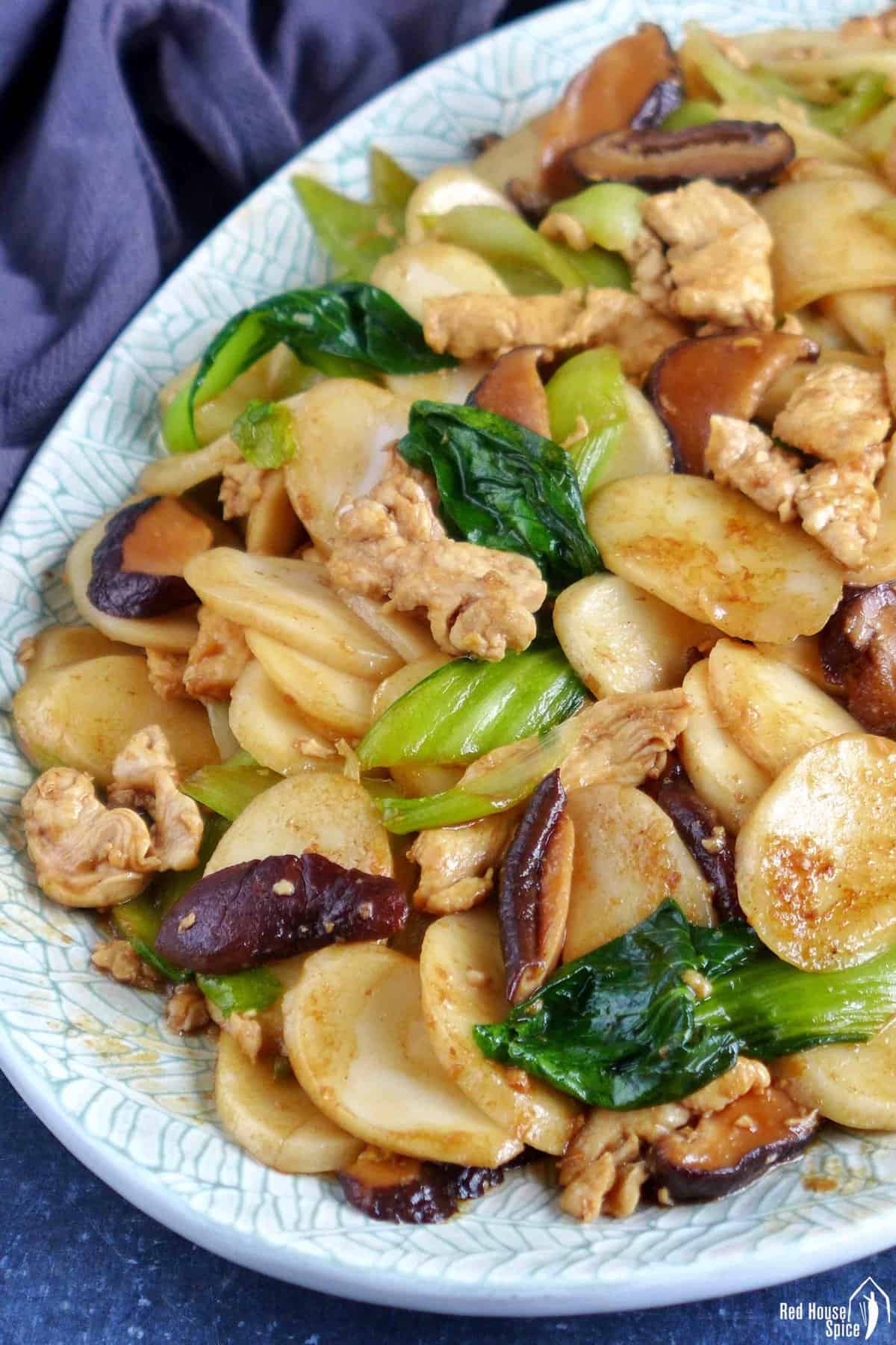 stir-fried rice cakes with chicken and vegetables.