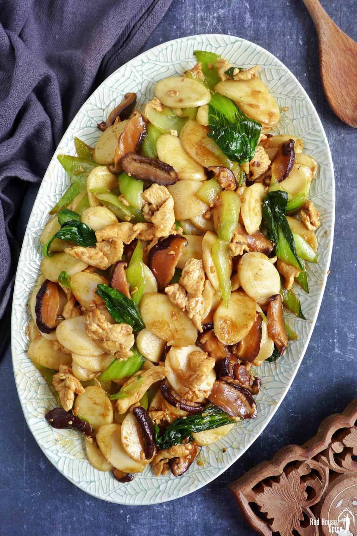 a plate of chinese rice cake stir-fry.