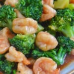 stir-fried shrimp and broccoli on a plate.