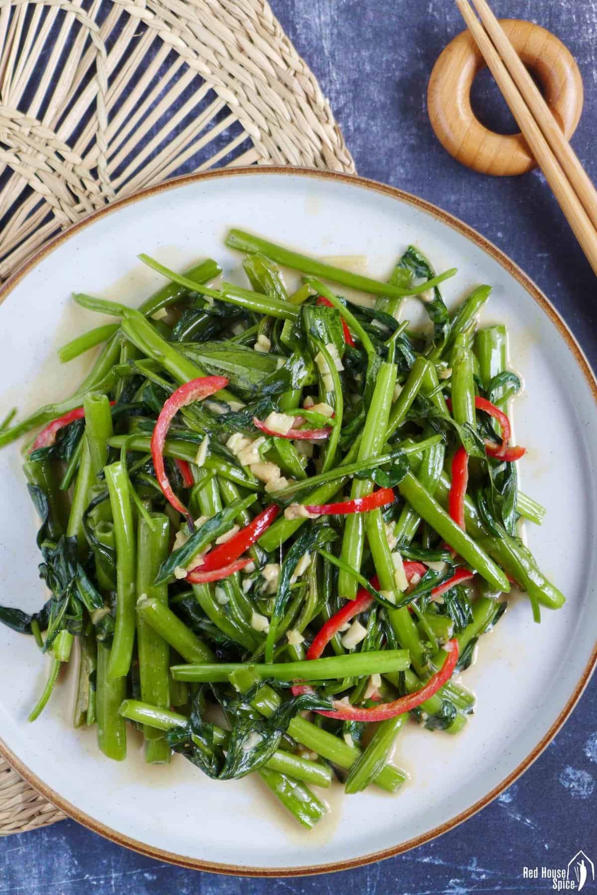 a plateful of stir-fried water spinach