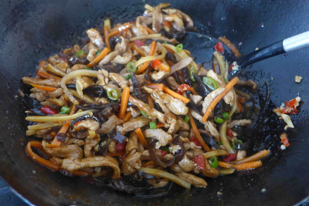 stir-frying pork, vegetables with sauce.