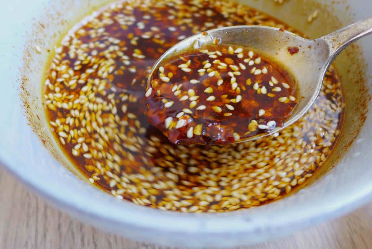 Stirring chili flakes and oil.