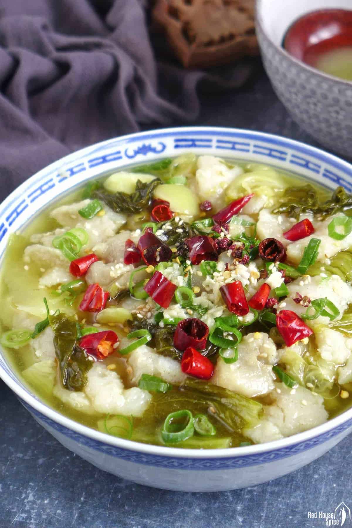 a bowl of Suan Cai Yu, Sichuan fish with sour vegetable
