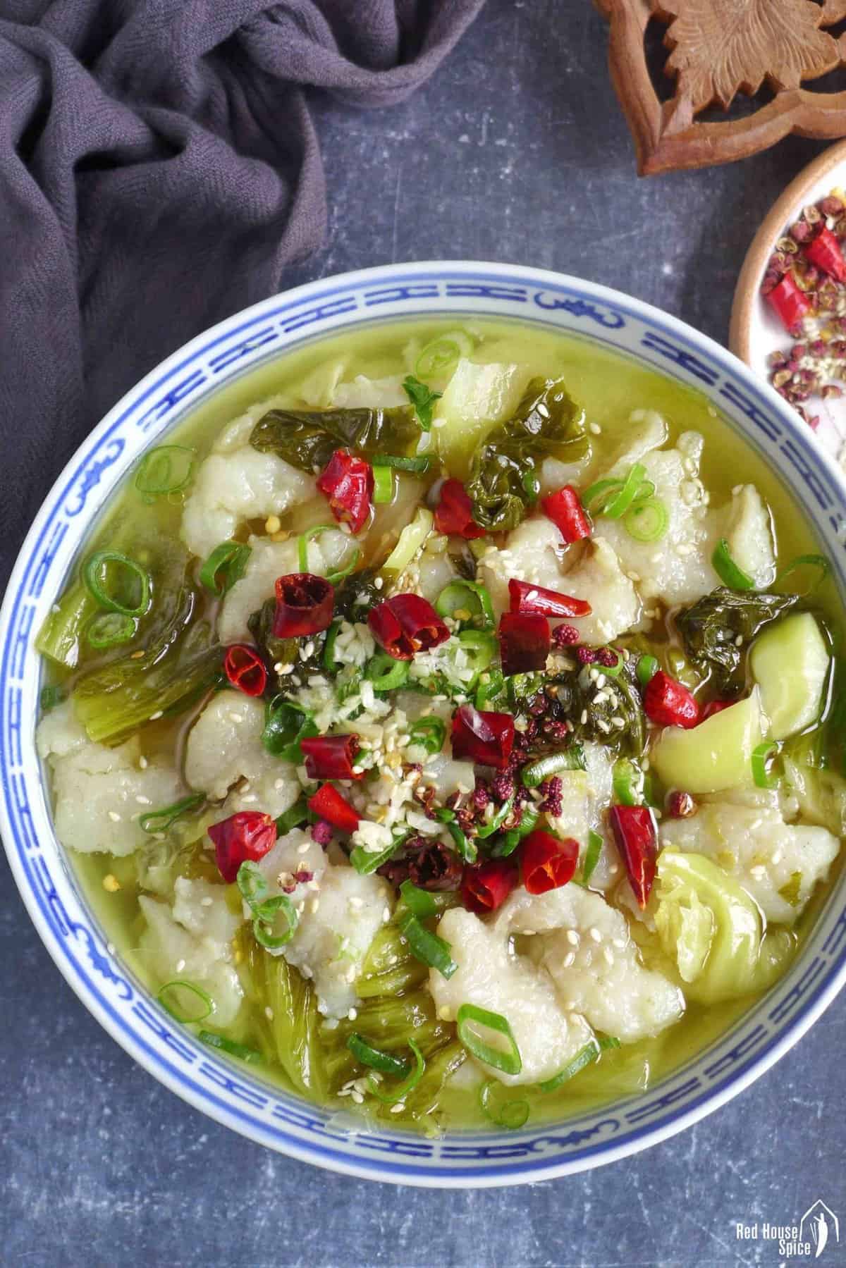 a bowl of Suan Cai Yu, Sichuan fish with sour vegetable
