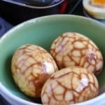 three Chinese tea eggs with marbled pattern.