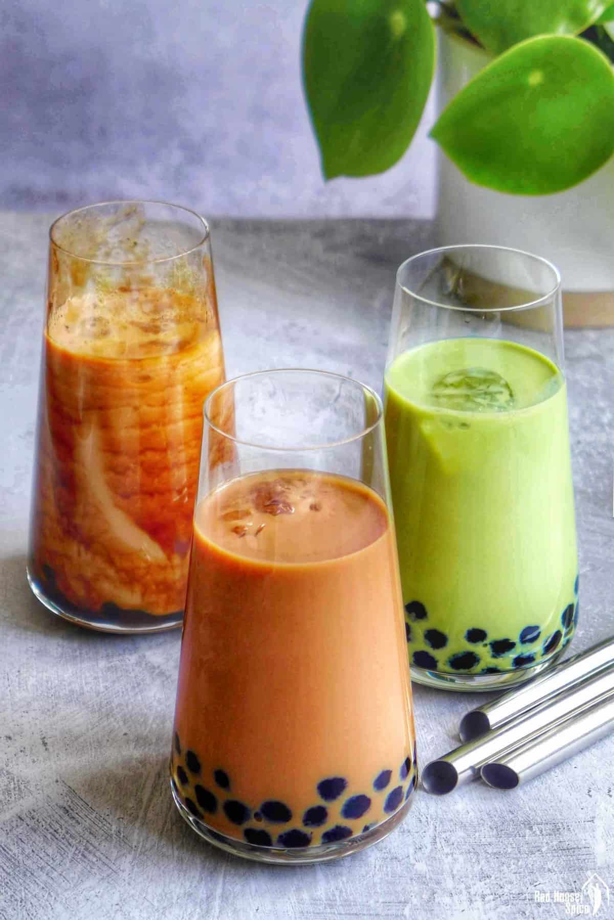 Three glasses of bubble tea with different colours