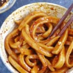 A bowl of Tian Shui Mian with overlay text that says sweet water noodles.