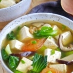 tofu and vegetable soup in two bowls.