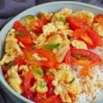 tomato and egg stir-fry over steamed rice.