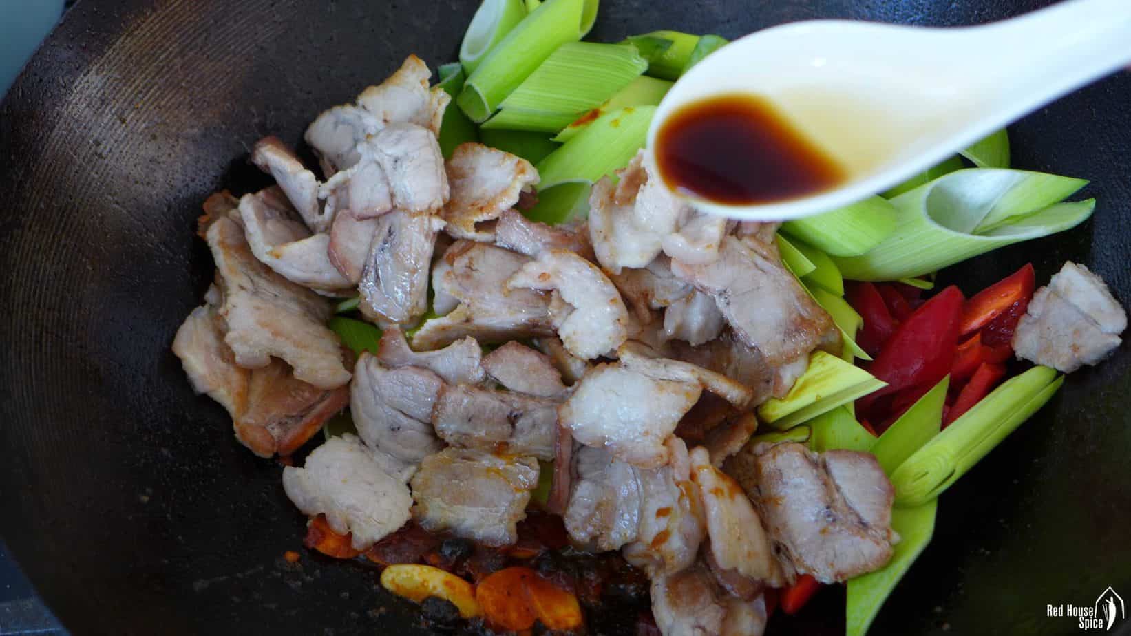 pork and leek in a wok