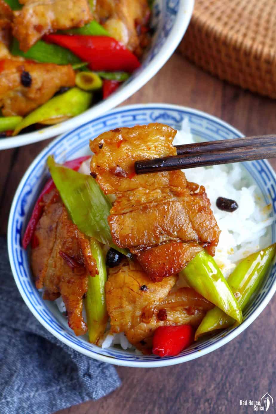 Chinese twice cooked pork over a bowl of rice