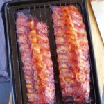two racks of Chinese BBQ ribs on a baking tray.