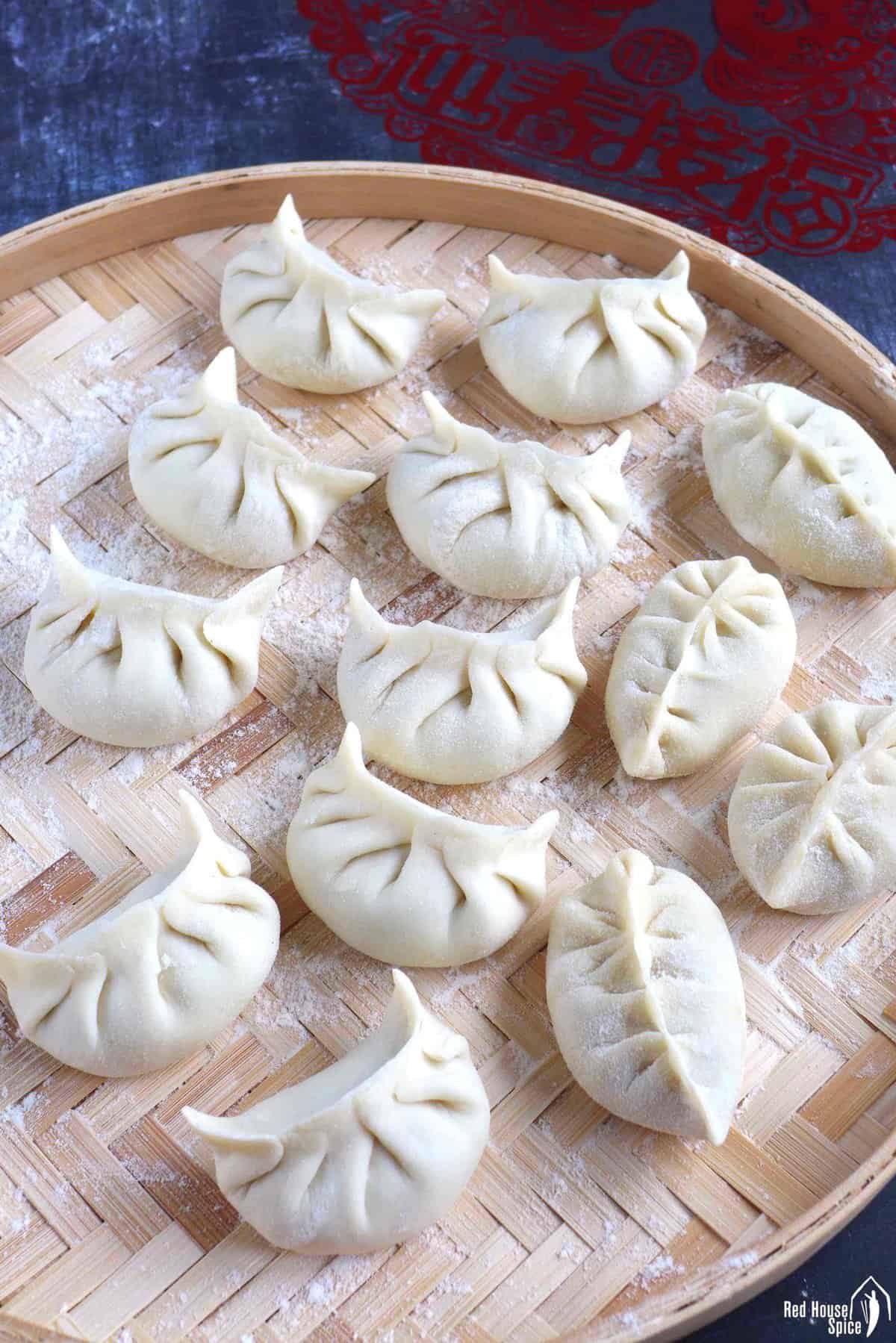 Uncooked dumplings on a tray