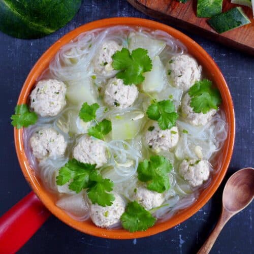 A pot of winter melon soup with meatballs & vermicelli noodles