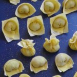 Wontons folded in six ways with overlay text that says how to fold wontons.