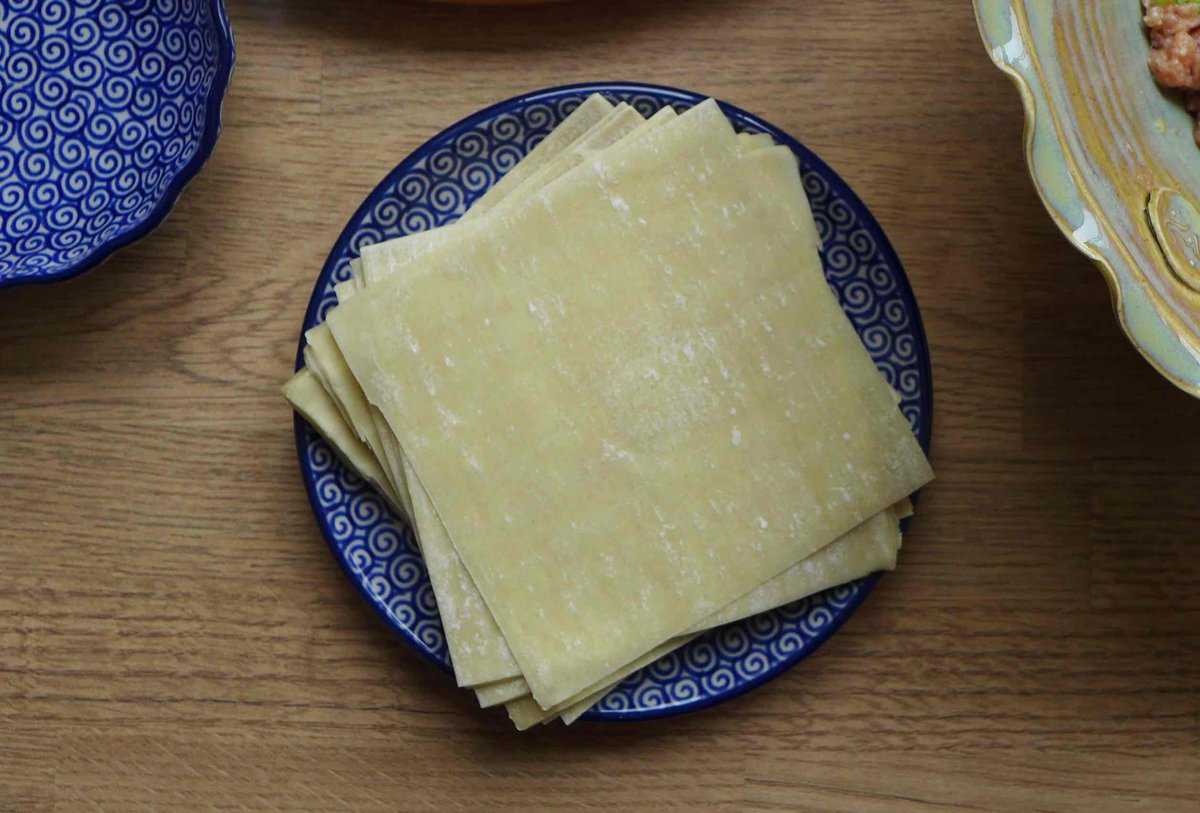 A pile of ready made wonton wrappers.