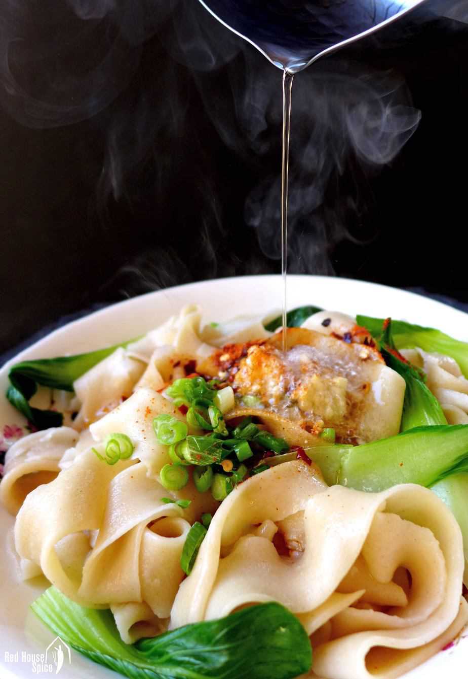 Hot oil pouring over Biang Biang noodles
