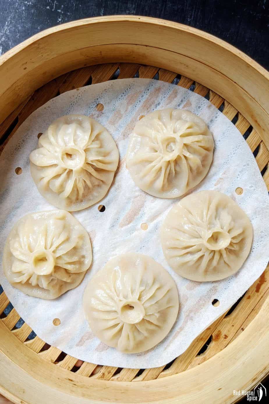 Soup dumplings in a steamer basket