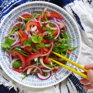 salad made of tomato, onion and coriander