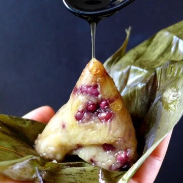 Honey pouring over a sticky rice dumpling