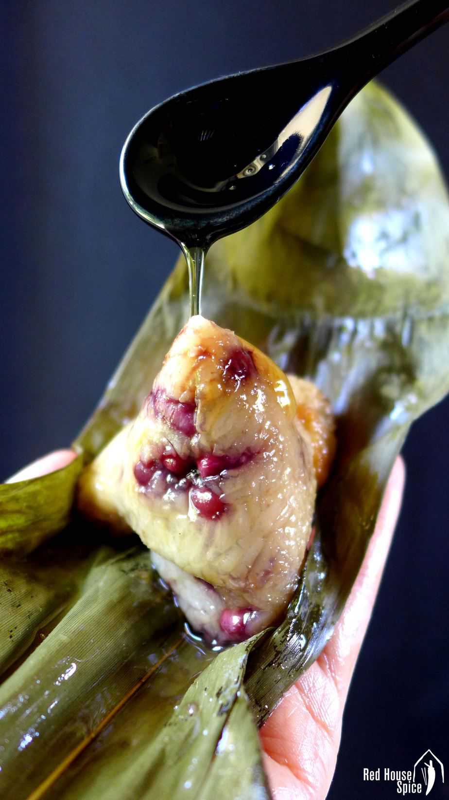Honey pouring over a sticky rice dumpling.